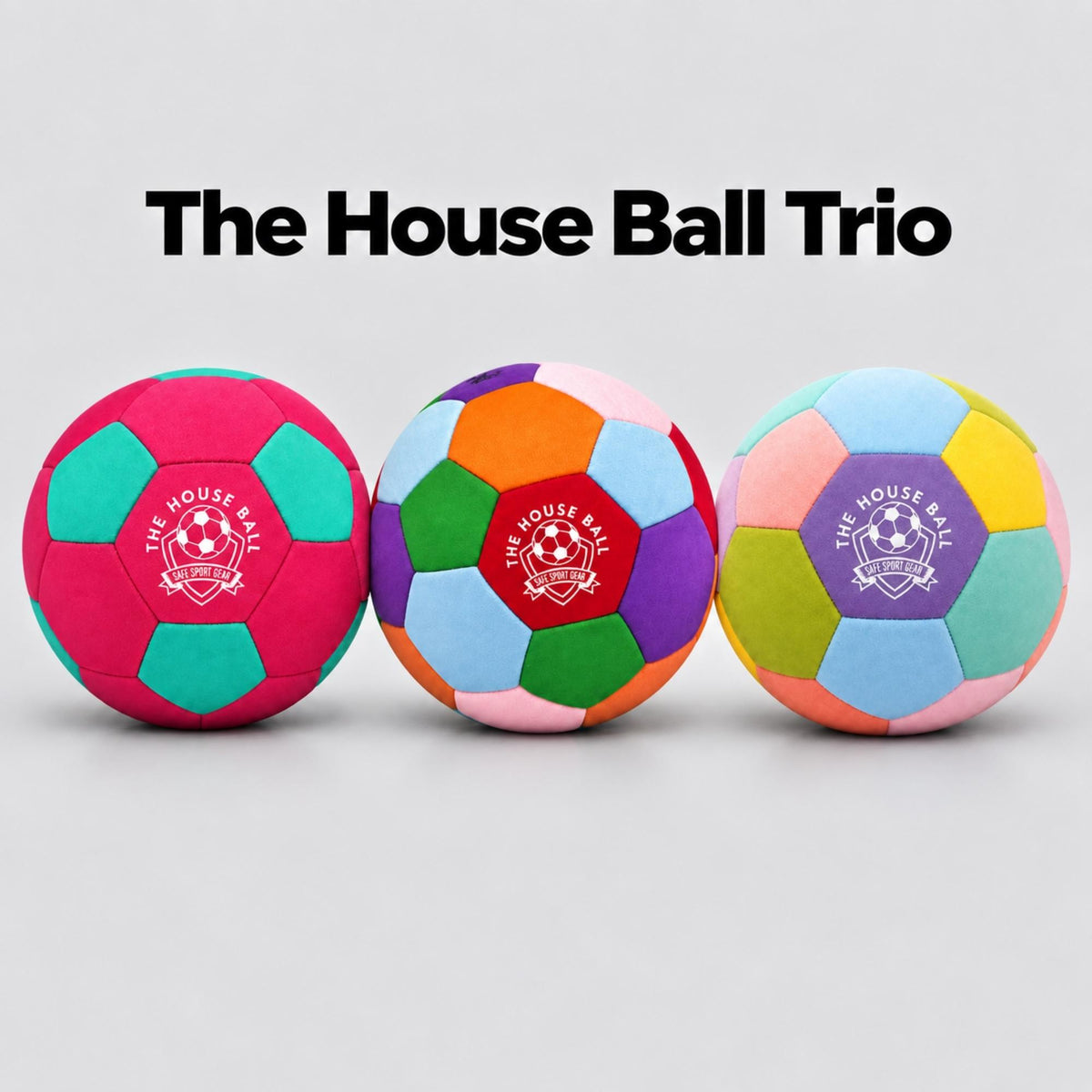 Three colorful House Balls displayed side by side on a light gray background with the text The House Ball Trio above them. The balls feature multiple bright colors in a geometric pattern, with a purple, pink, green, and orange center panel printed with the Safe Sport Gear logo.
