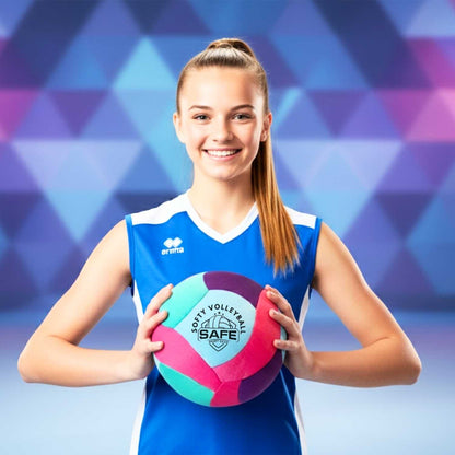 Young girl holding a Softy Volleyball-Teal against a geometric patterned background